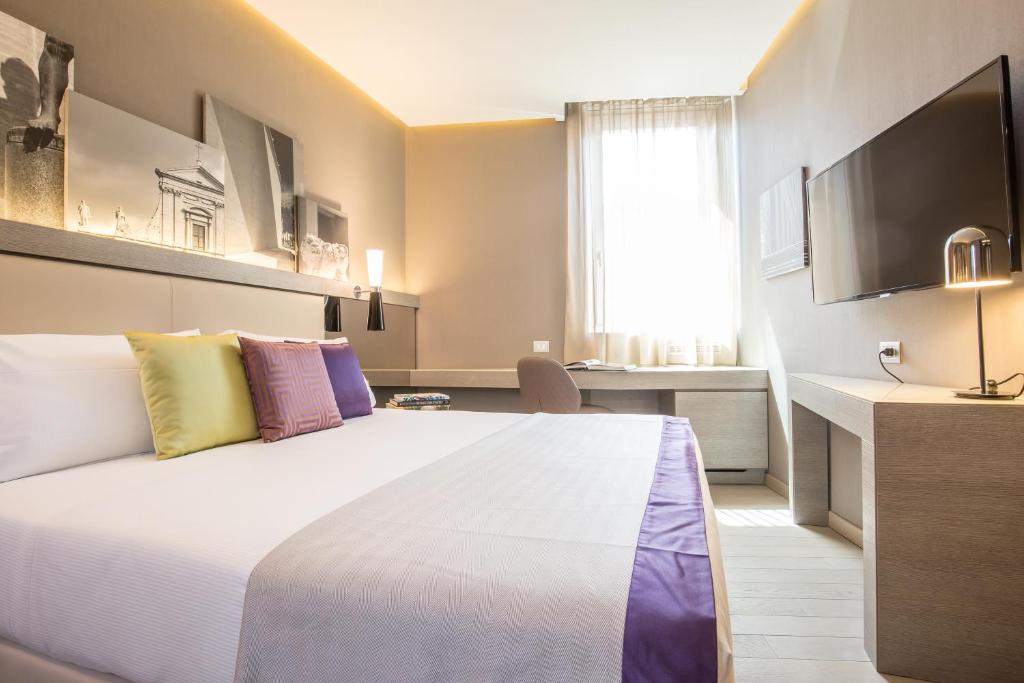 Postel nebo postele na pokoji v ubytování Orazio Palace Hotel