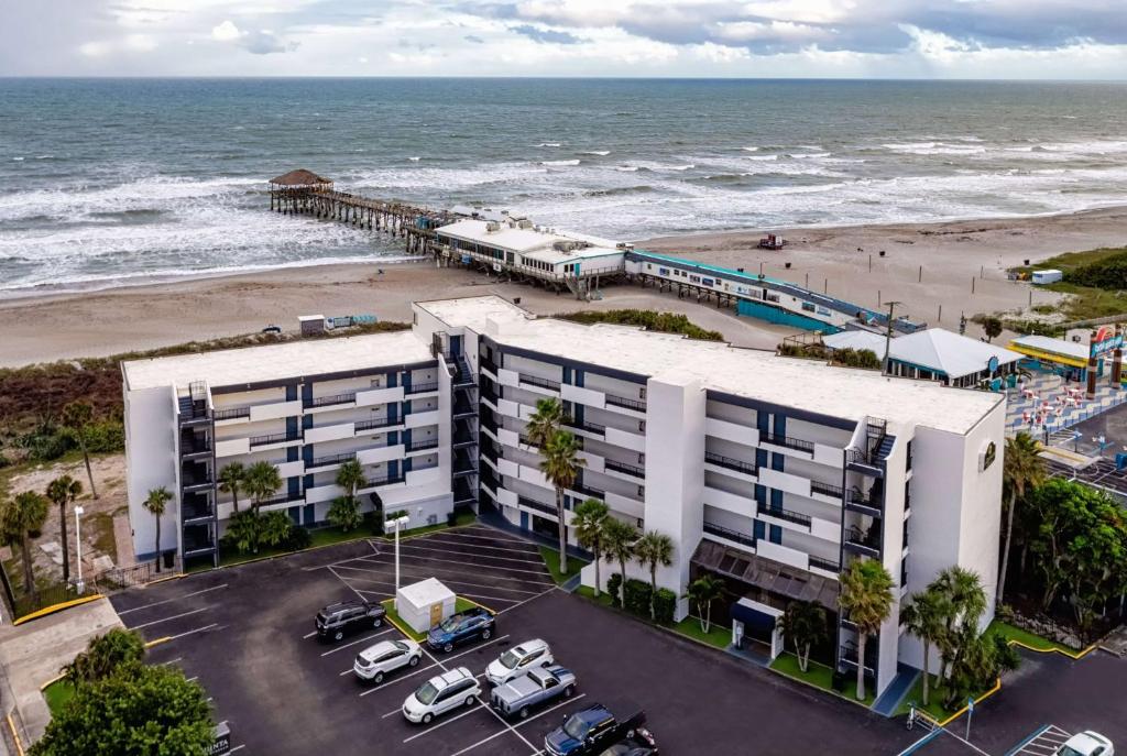an aerial view of a hotel next to the beach at La Quinta by Wyndham Cocoa Beach Oceanfront in Cocoa Beach