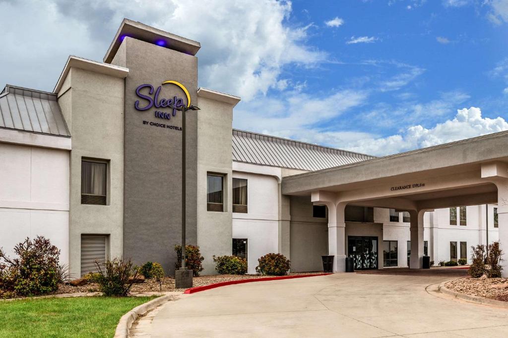 a building with a sap sign on the side of it at Sleep Inn in Clovis