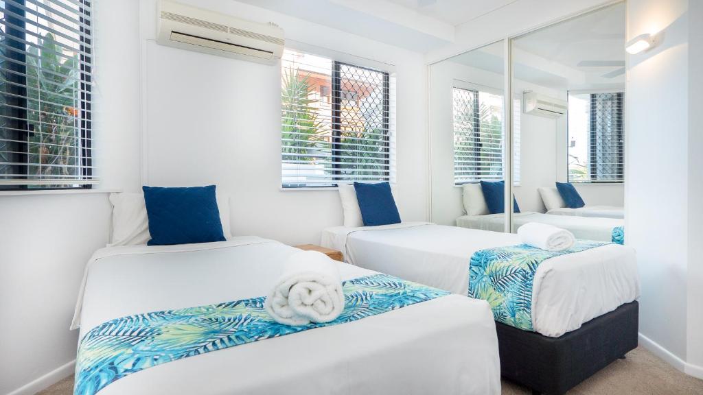 Letto o letti in una camera di Aegean Mooloolaba