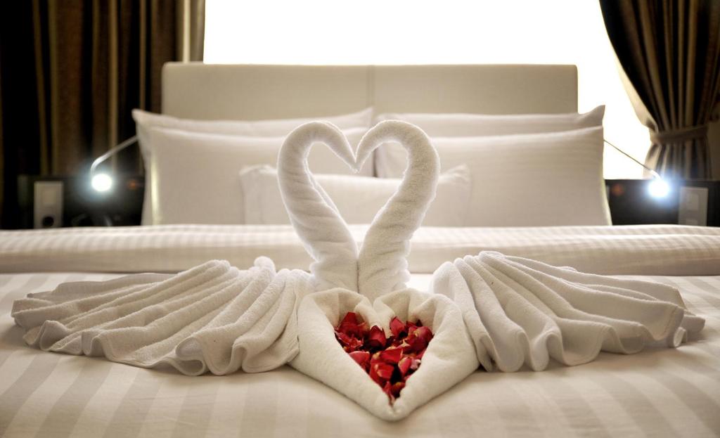 Postel nebo postele na pokoji v ubytování Sun Boutique Hotel