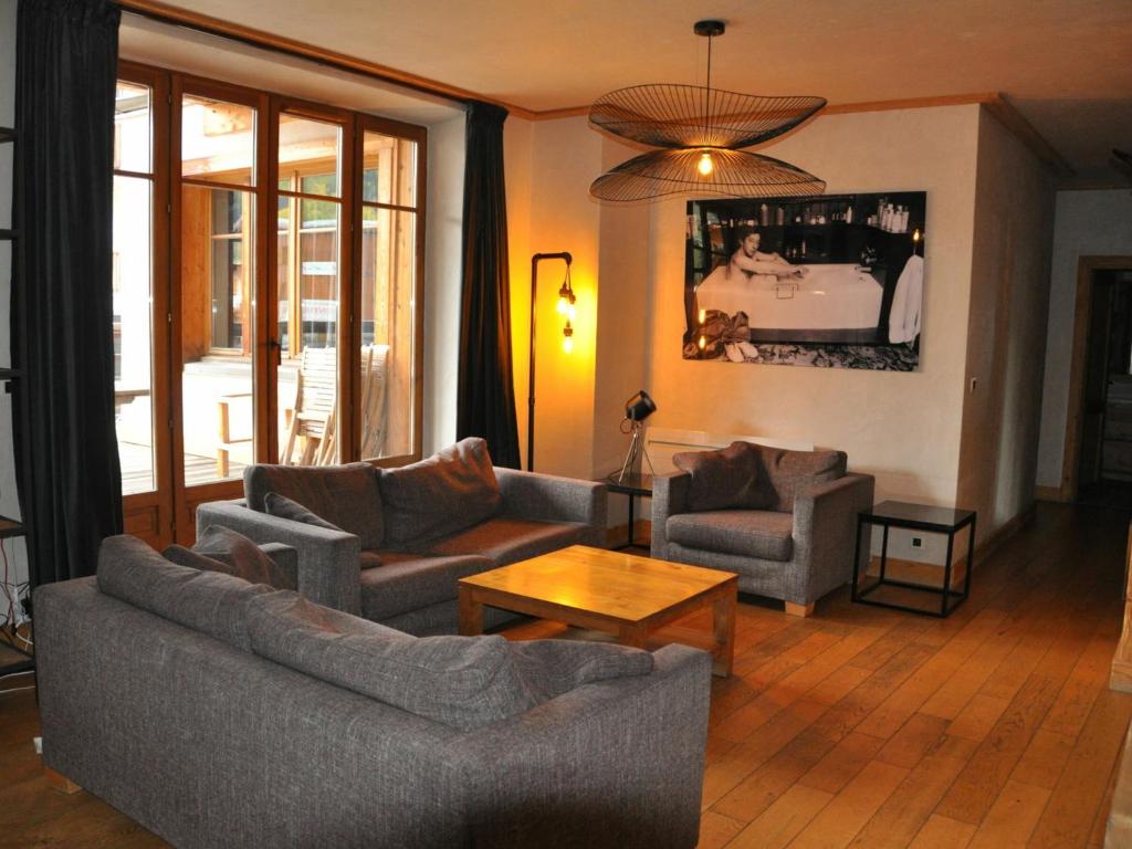 a living room with two couches and a table at Appartement Les Deux Alpes, 5 pièces, 8 personnes - FR-1-348-173 in Les Deux Alpes