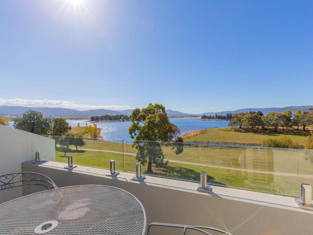 a view of a lake from the balcony of a house at Horizons 219/10 Kosciuszko Road in Jindabyne