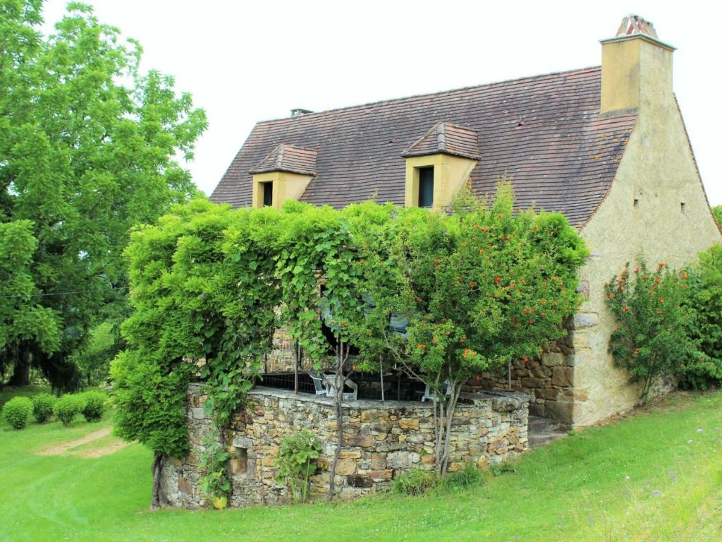 an old stone house with trees in front of it at Gîte Belvès, 4 pièces, 6 personnes - FR-1-616-86 in Larzac