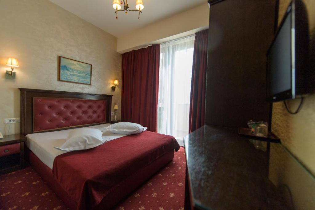Postel nebo postele na pokoji v ubytování Hotel Golden Palace