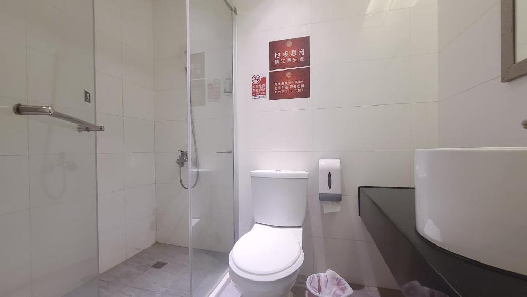 Koupelna v ubytování Chao She Hotel
