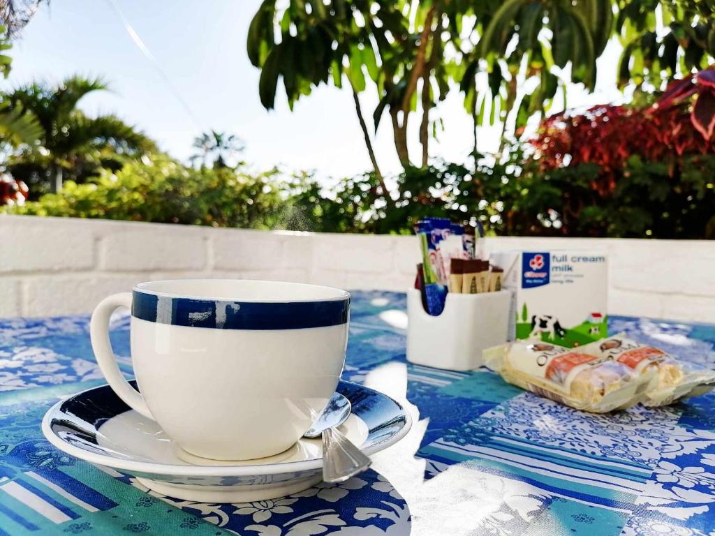 a cup and a plate on a table at Boathouse Bed & Biscuit - Lower Deck in Margate