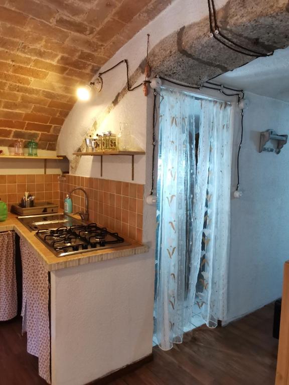 Kuchyň nebo kuchyňský kout v ubytování Casa MANETTA