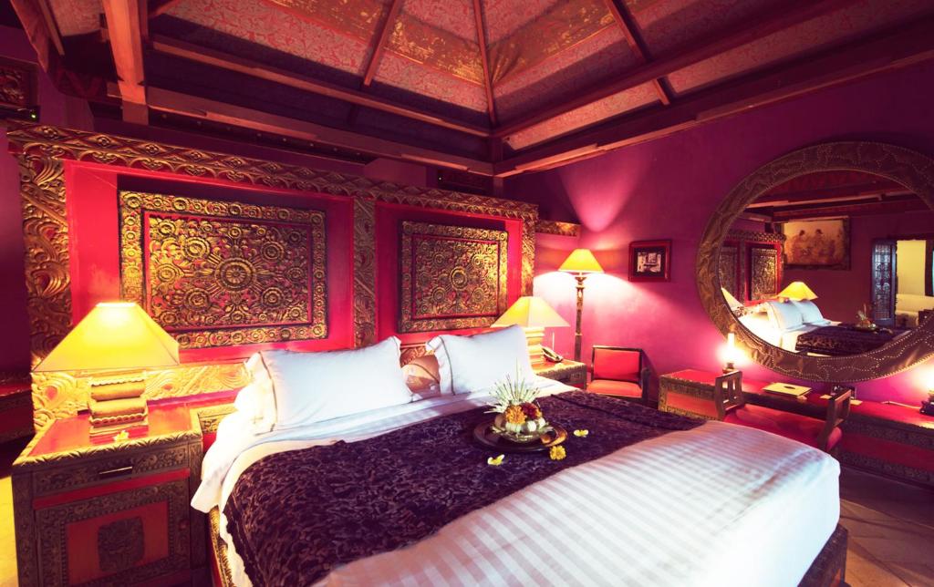 Postel nebo postele na pokoji v ubytování Hotel Tugu Bali