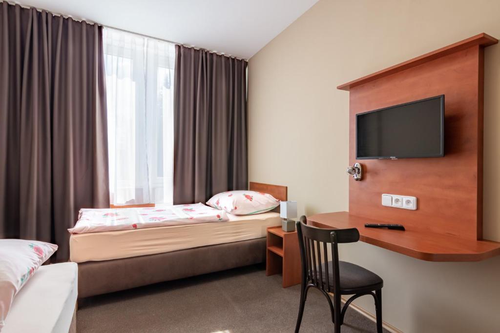 Postel nebo postele na pokoji v ubytování Hotel Alfa