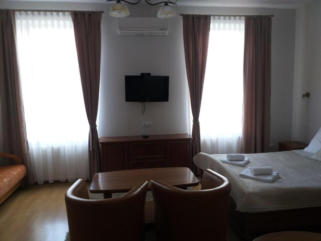 Łóżko lub łóżka w pokoju w obiekcie Pensjonat Zamek Dersława