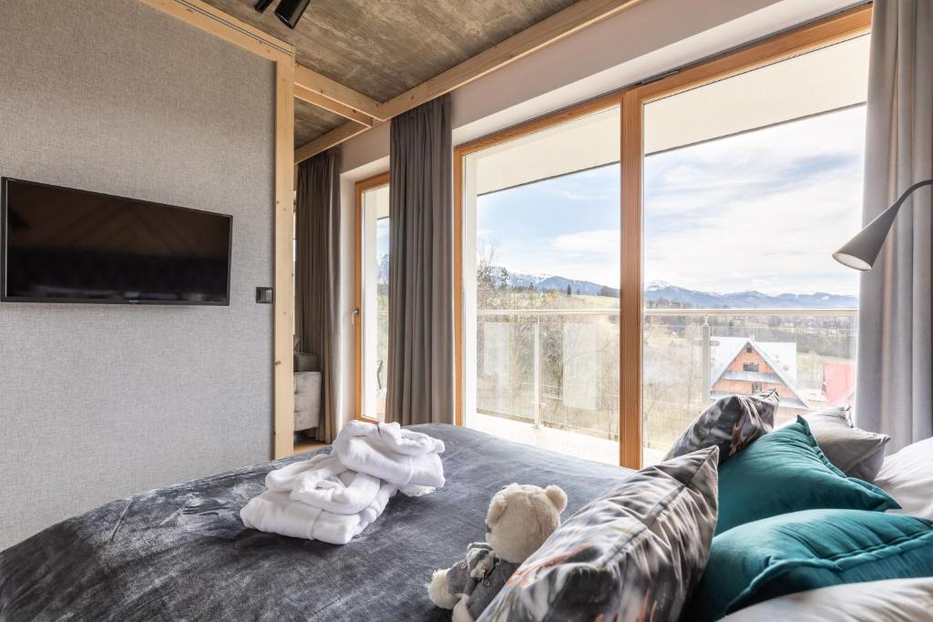 Posteľ alebo postele v izbe v ubytovaní Apartamenty Bachledzki Wierch Zakopane
