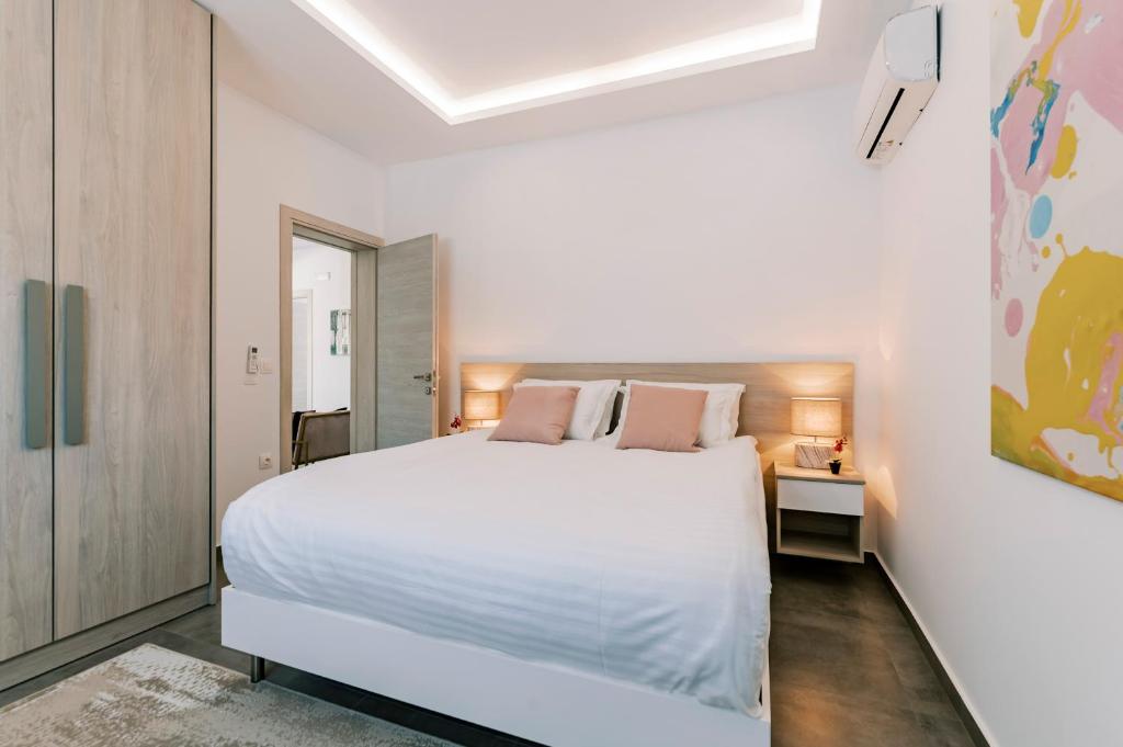 Postel nebo postele na pokoji v ubytování M Mansion