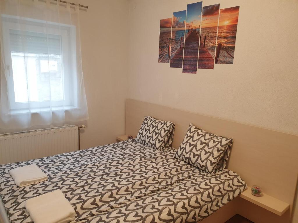 Postel nebo postele na pokoji v ubytování Sétány Szálló Siófok