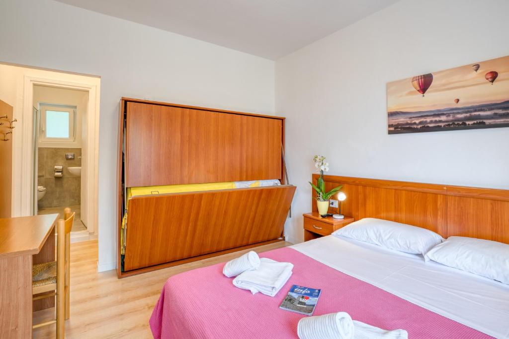 Postel nebo postele na pokoji v ubytování Hotel Casa Piantoni
