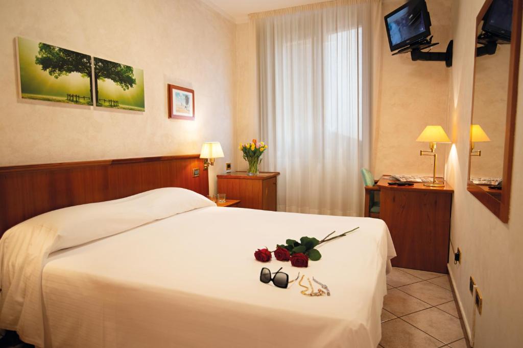 Telewizja i/lub zestaw kina domowego w obiekcie Hotel Corte Regina