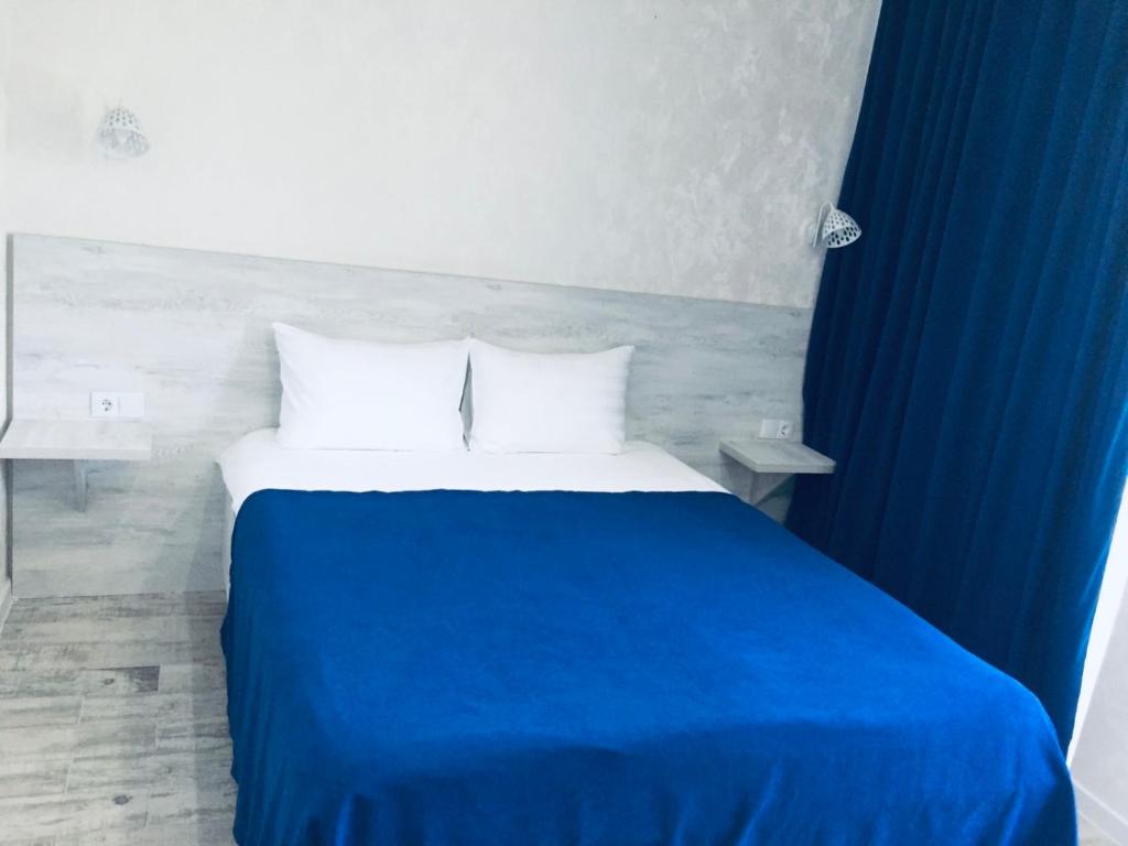 Postel nebo postele na pokoji v ubytování Villa Royal