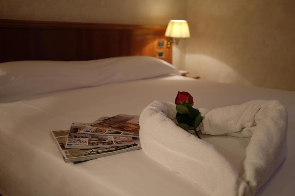 Łóżko lub łóżka w pokoju w obiekcie Hotel Corte Regina