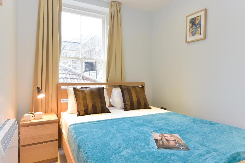 Postel nebo postele na pokoji v ubytování Liverpool Street City Living