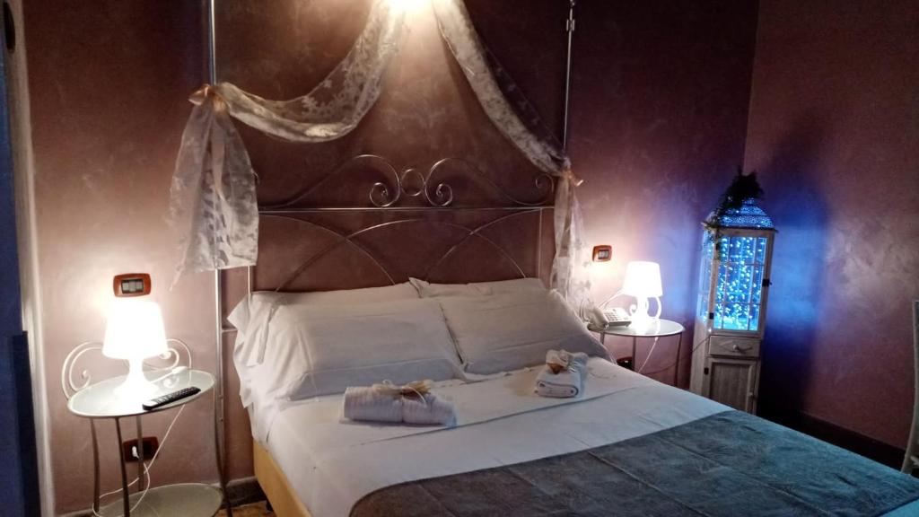 Postel nebo postele na pokoji v ubytování Relais Castrum Boccea