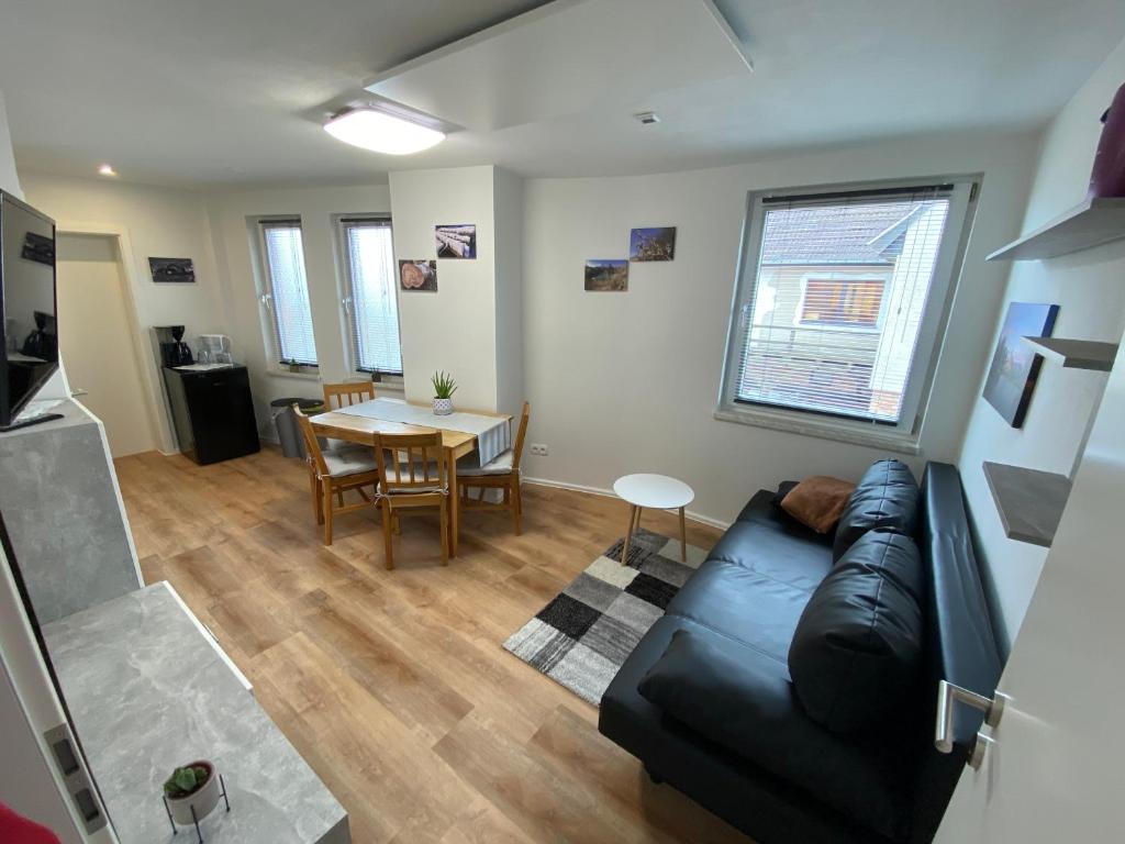 a living room with a couch and a table at Ihre Vorteilswelt in Gielow
