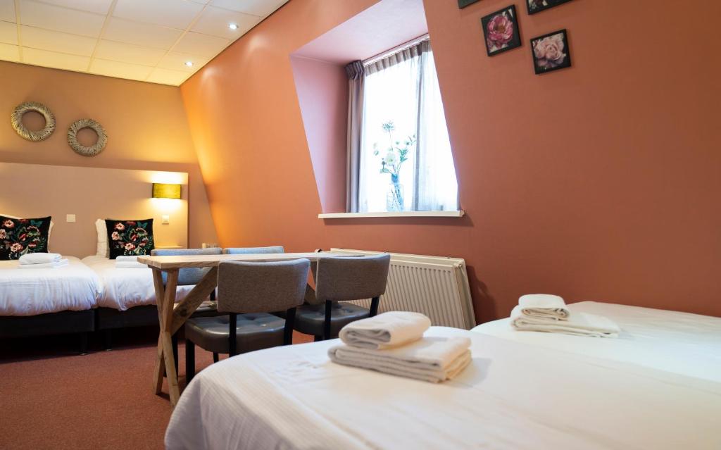 Postel nebo postele na pokoji v ubytování Hotel Villa Flora