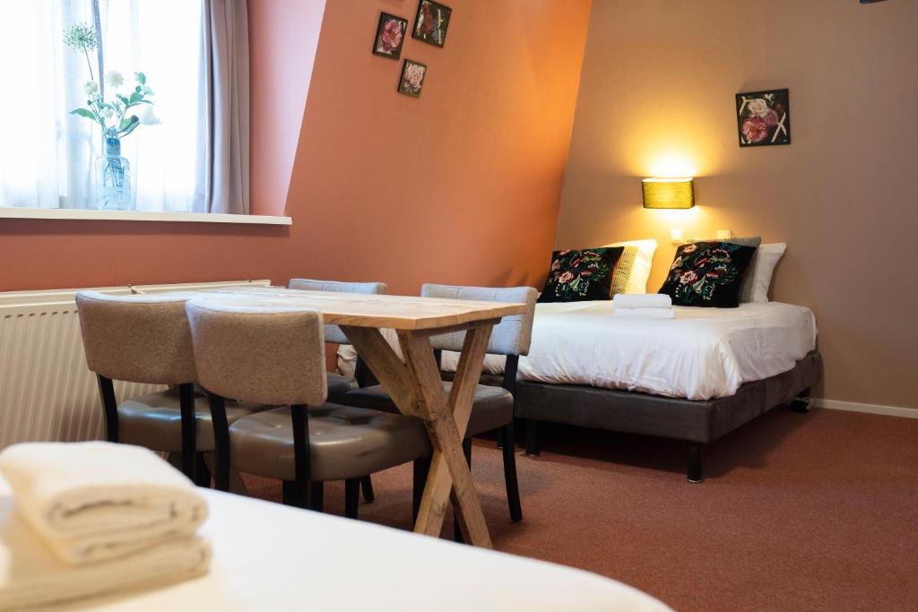 Postel nebo postele na pokoji v ubytování Hotel Villa Flora