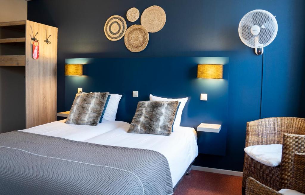 Postel nebo postele na pokoji v ubytování Hotel Villa Flora