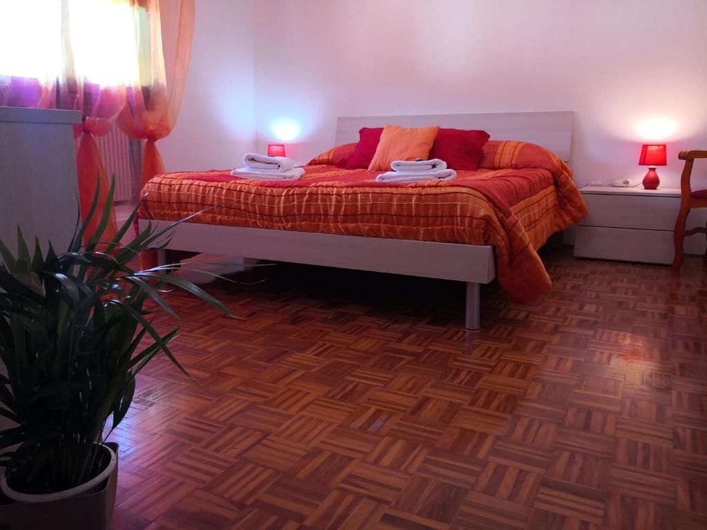 Postel nebo postele na pokoji v ubytování B&B Arcobaleno