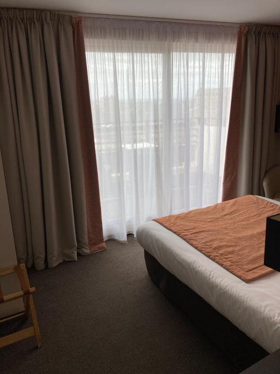 Postel nebo postele na pokoji v ubytování Hotel Georges