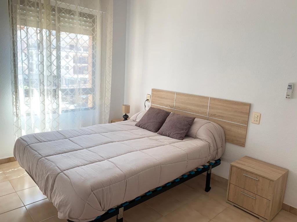 A bed or beds in a room at Apartamentos Playa del Cargador 3000