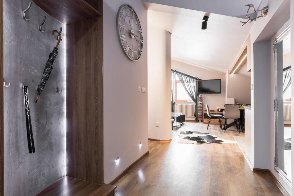Televízia a/alebo spoločenská miestnosť v ubytovaní Apartament Top Zakopane
