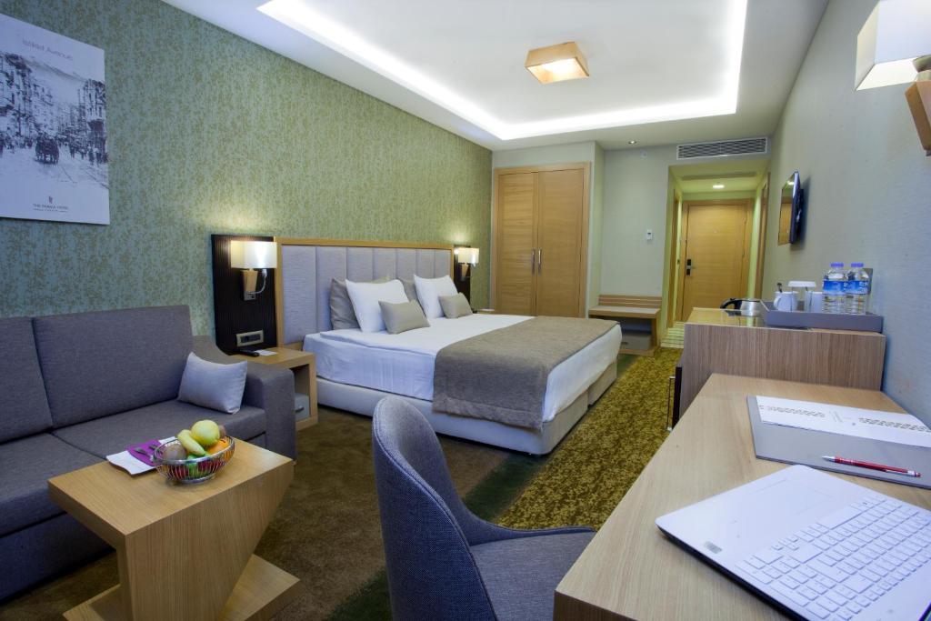 A bed or beds in a room at The Parma Hotel & Spa Taksim