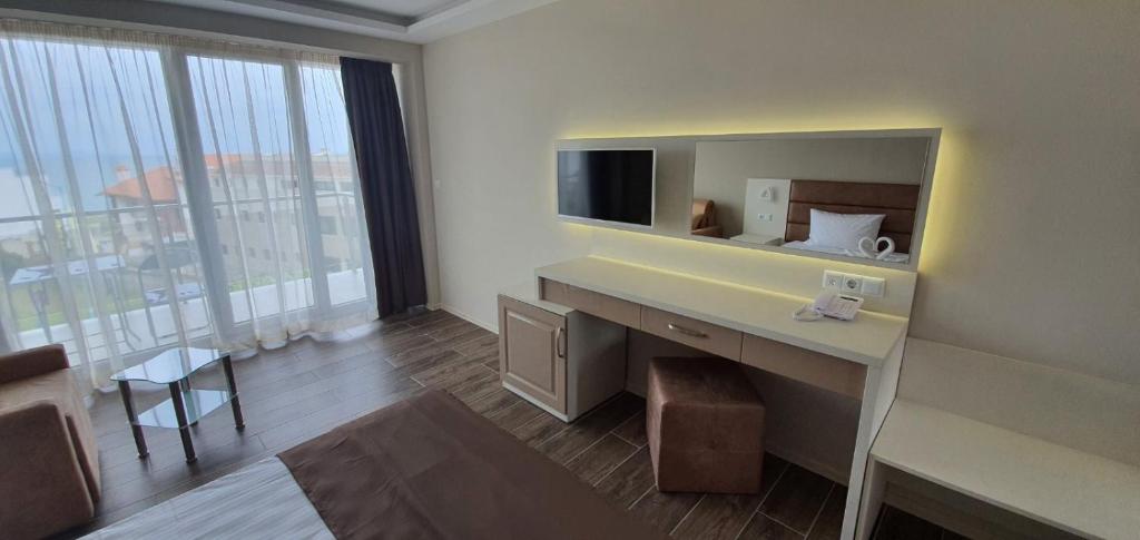 TV a/nebo společenská místnost v ubytování Hotel Sunny