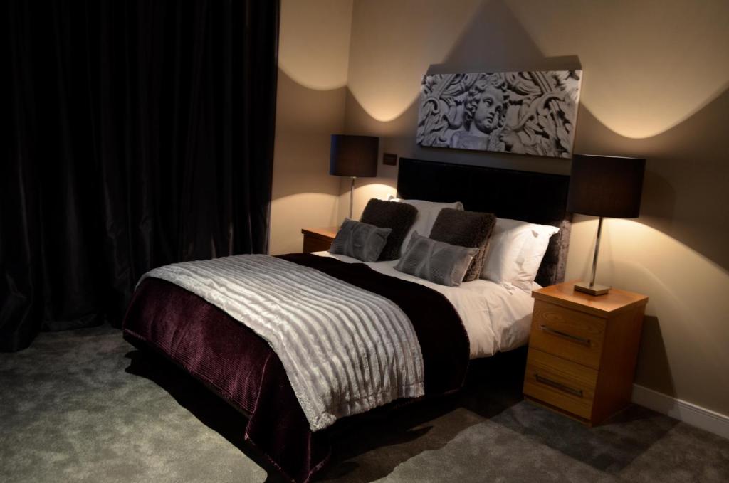 Postel nebo postele na pokoji v ubytování Quebecs Luxury Aparthotel