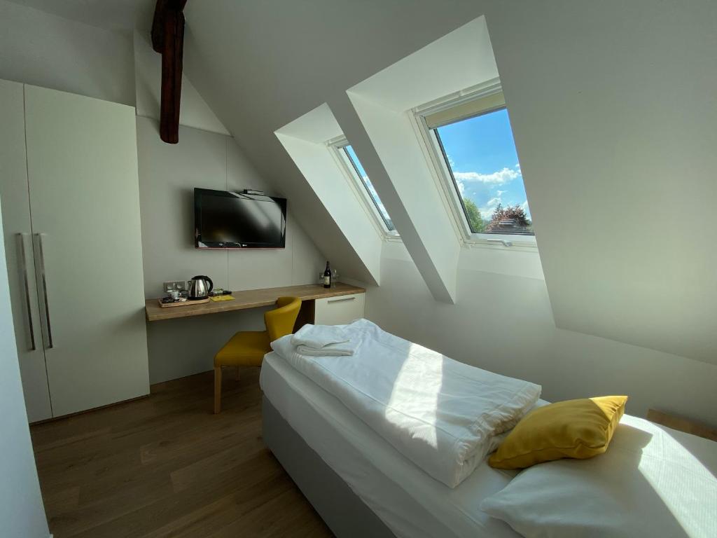 Postel nebo postele na pokoji v ubytování Hotel Slavia