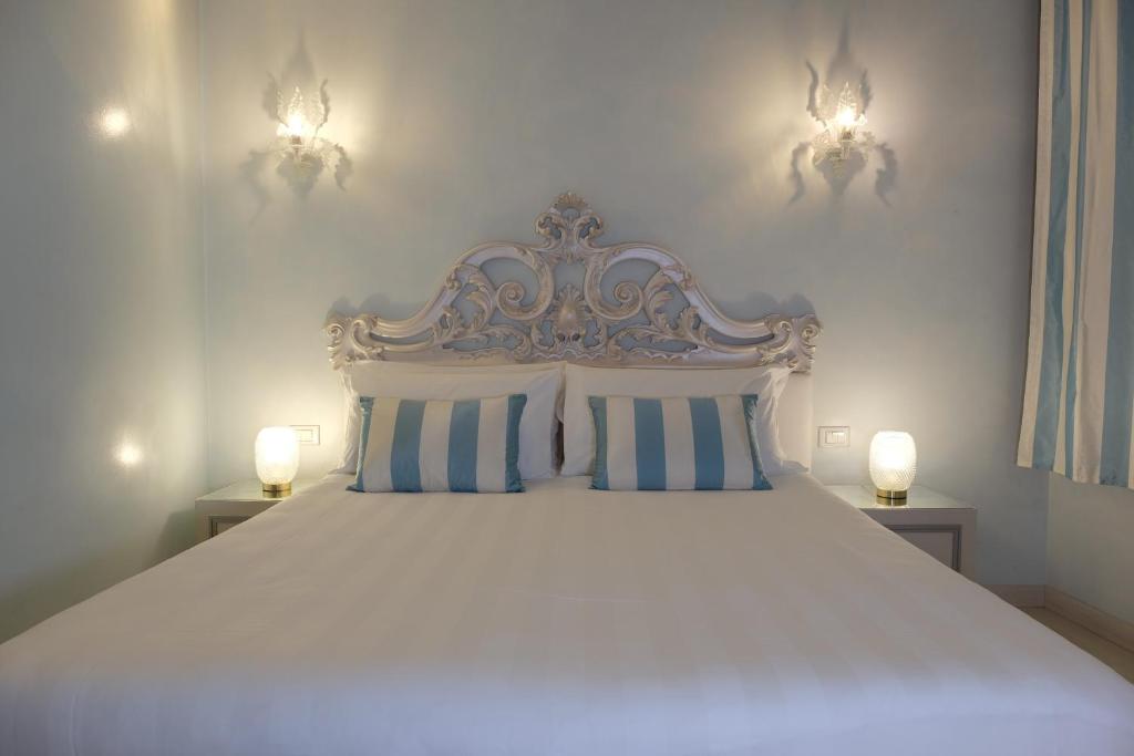 Postel nebo postele na pokoji v ubytování Relais Venezia