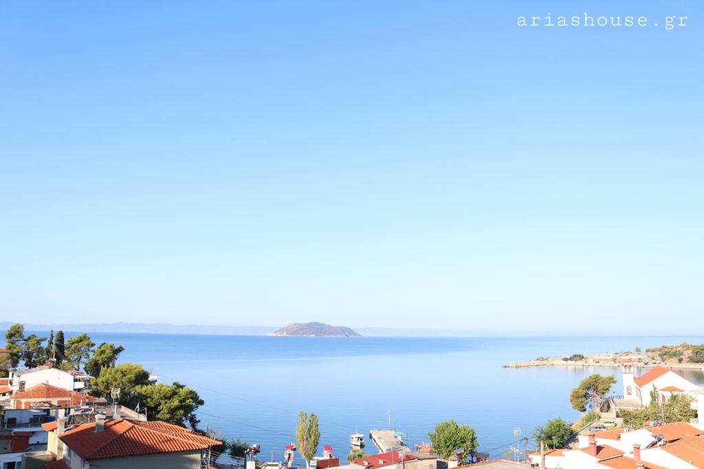 a view of the ocean from a city at Aria's House Studios & Apartments in Neos Marmaras