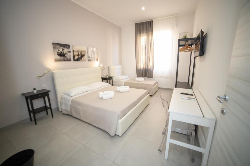 Postel nebo postele na pokoji v ubytování b&b Zio Luciano