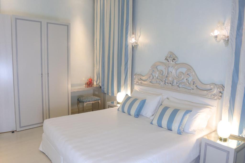 Postel nebo postele na pokoji v ubytování Relais Venezia
