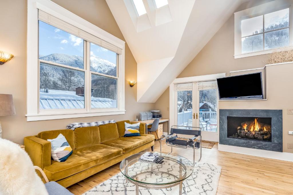 a living room with a couch and a fireplace at Pacific West 431 in Telluride