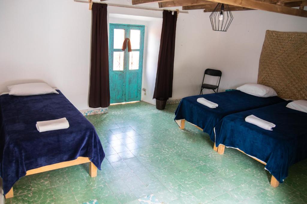 Postel nebo postele na pokoji v ubytování PATIO Alojamiento