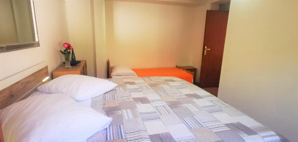 Postel nebo postele na pokoji v ubytování Apartmani Divić