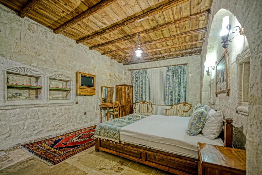 Postel nebo postele na pokoji v ubytování Elysee Cave House