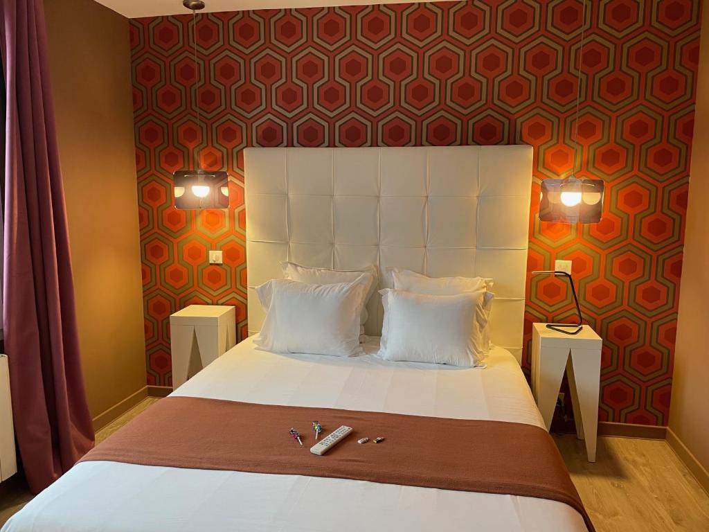 Postel nebo postele na pokoji v ubytování Hôtel Mirano