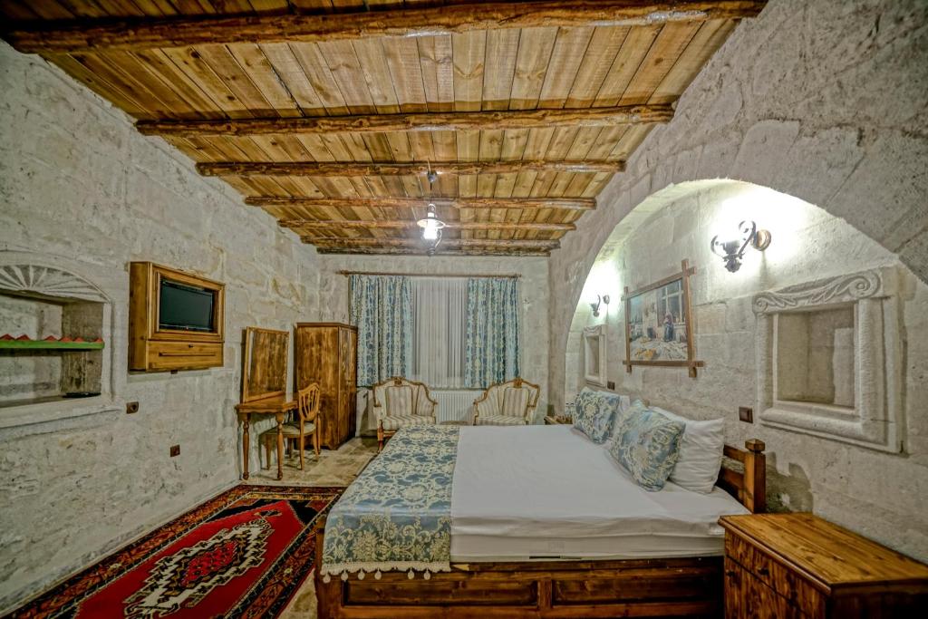 Postel nebo postele na pokoji v ubytování Elysee Cave House