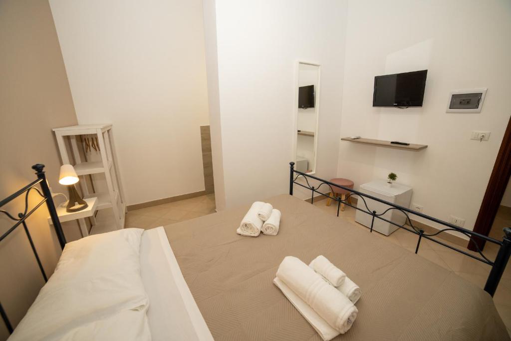 Postel nebo postele na pokoji v ubytování b&b Zio Luciano