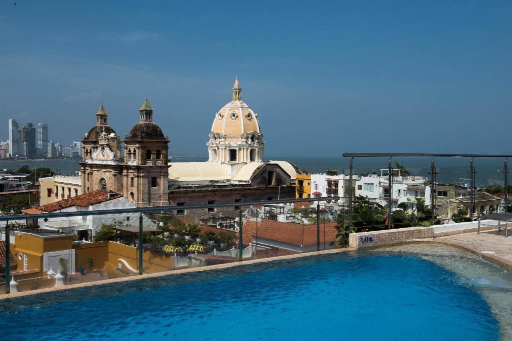 a view of a building with a large swimming pool at Blue Diamond Club at Movich Cartagena in Cartagena de Indias