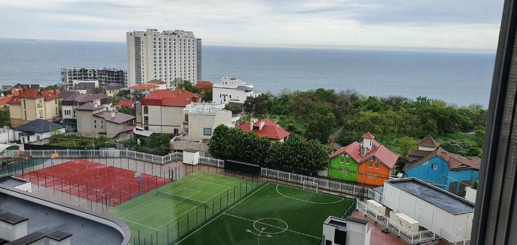 a view of a city with a tennis court at Апартаменты с видом на море in Odesa