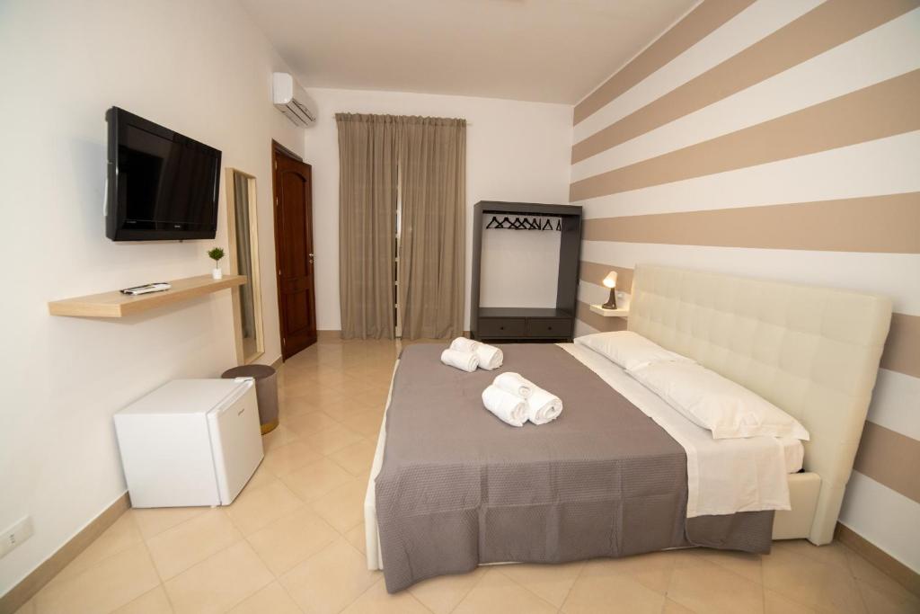 Postel nebo postele na pokoji v ubytování b&b Zio Luciano